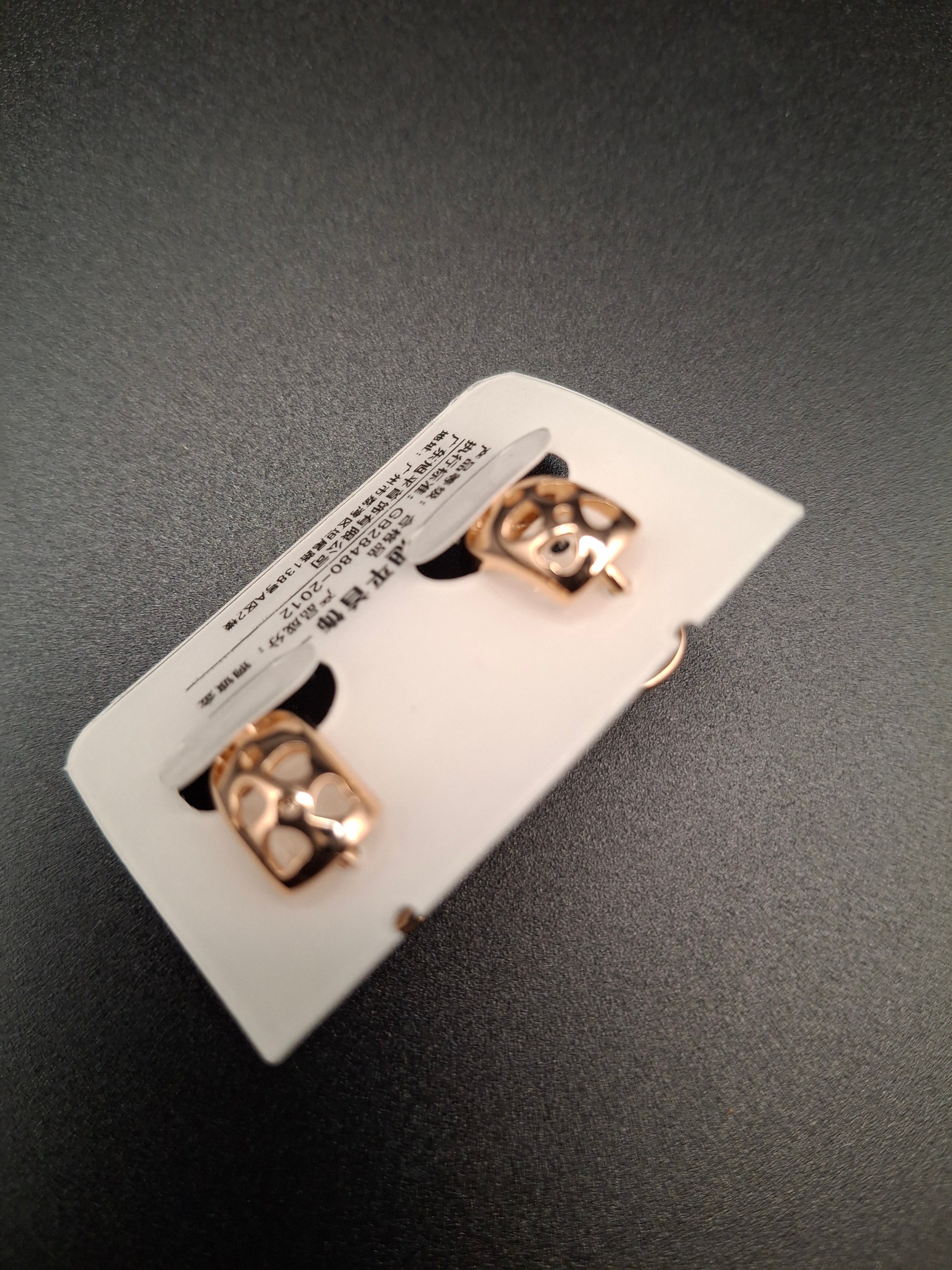 White cowy rose gold earrings