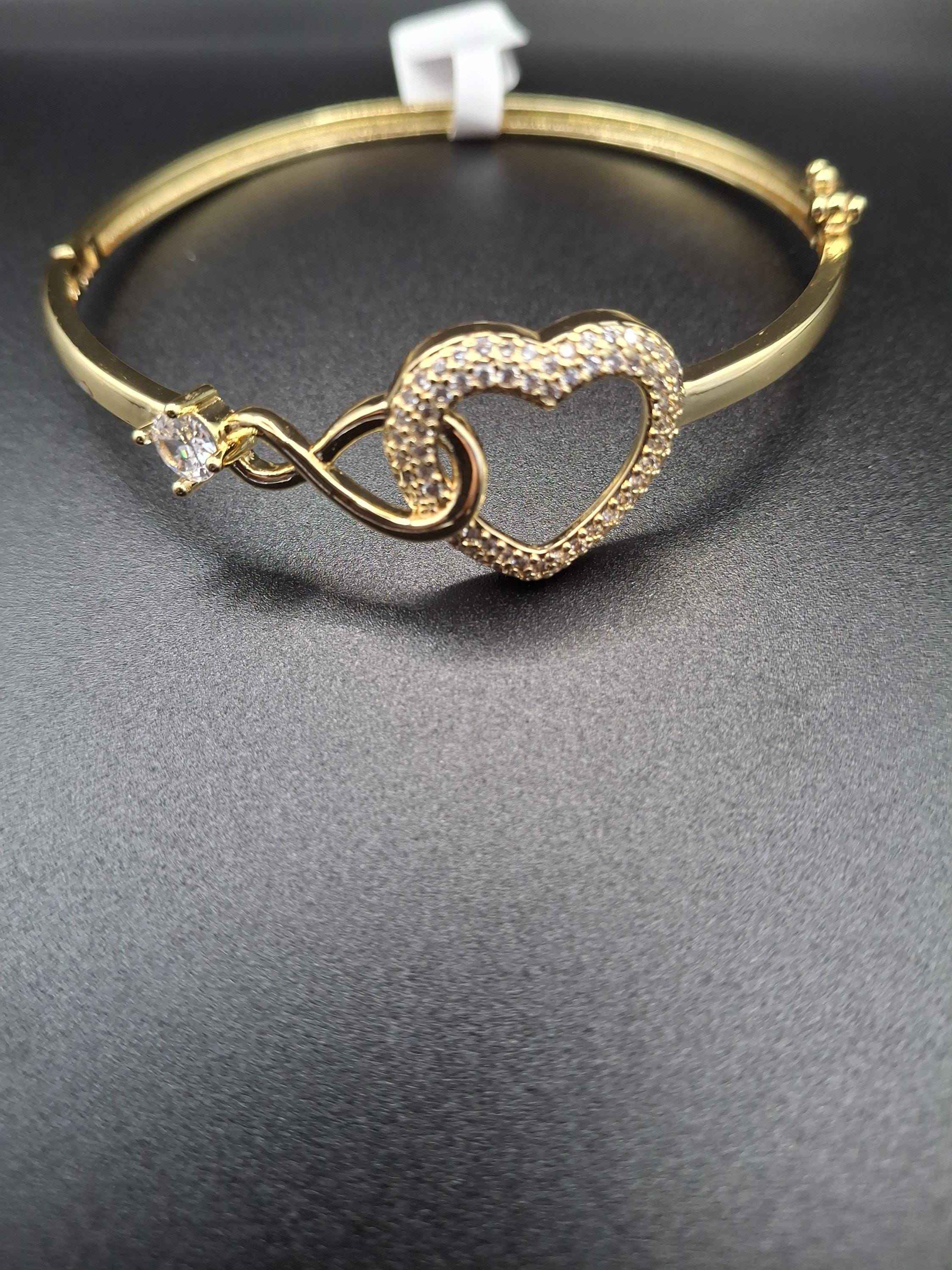 Gold heart bangle